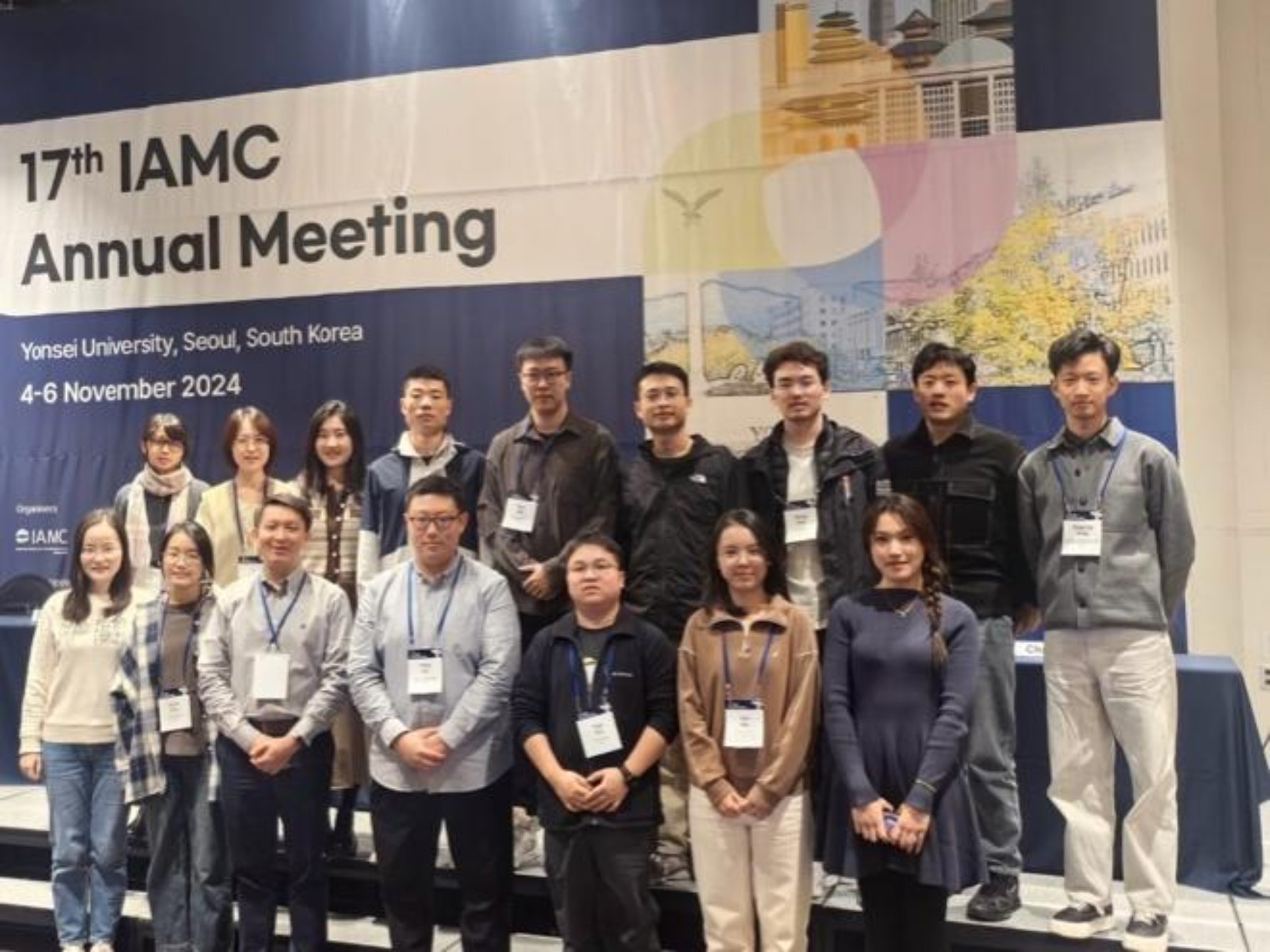 A group of people posing for a photo
Description automatically generated